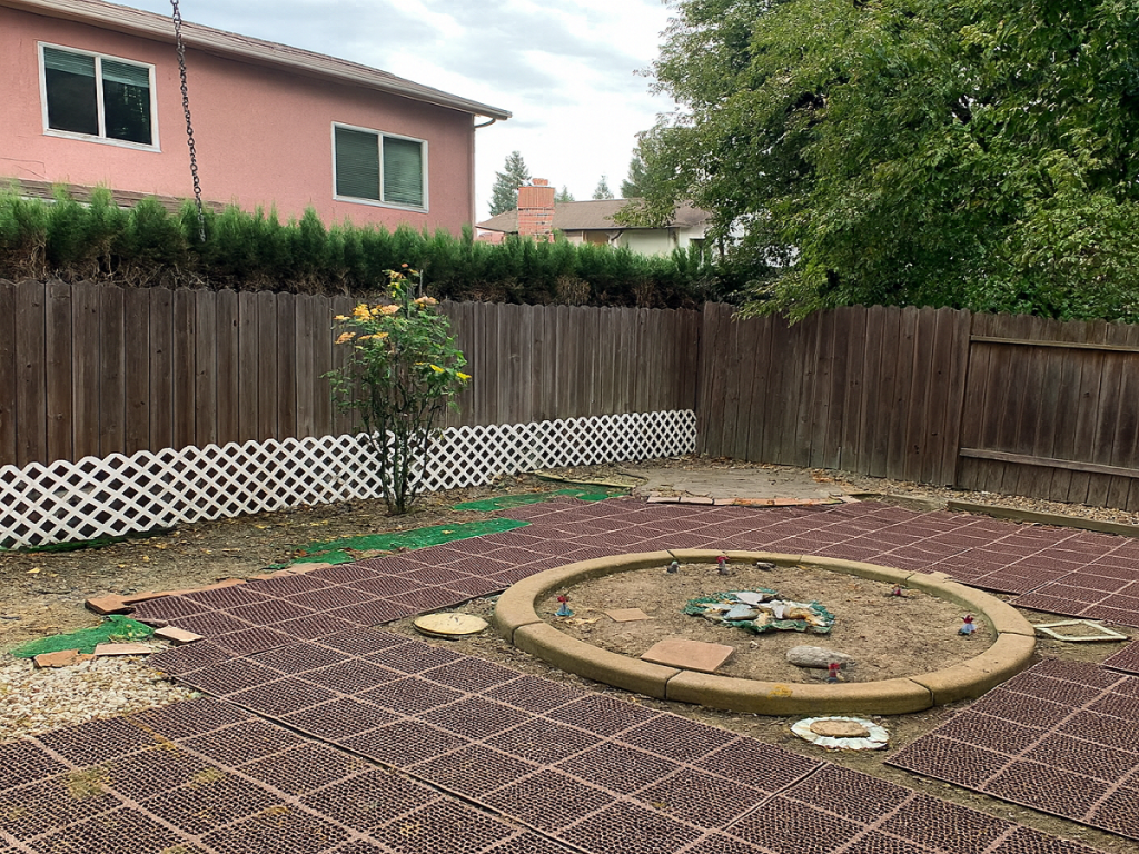 Backyard showing repair issues common in homes sold as-is