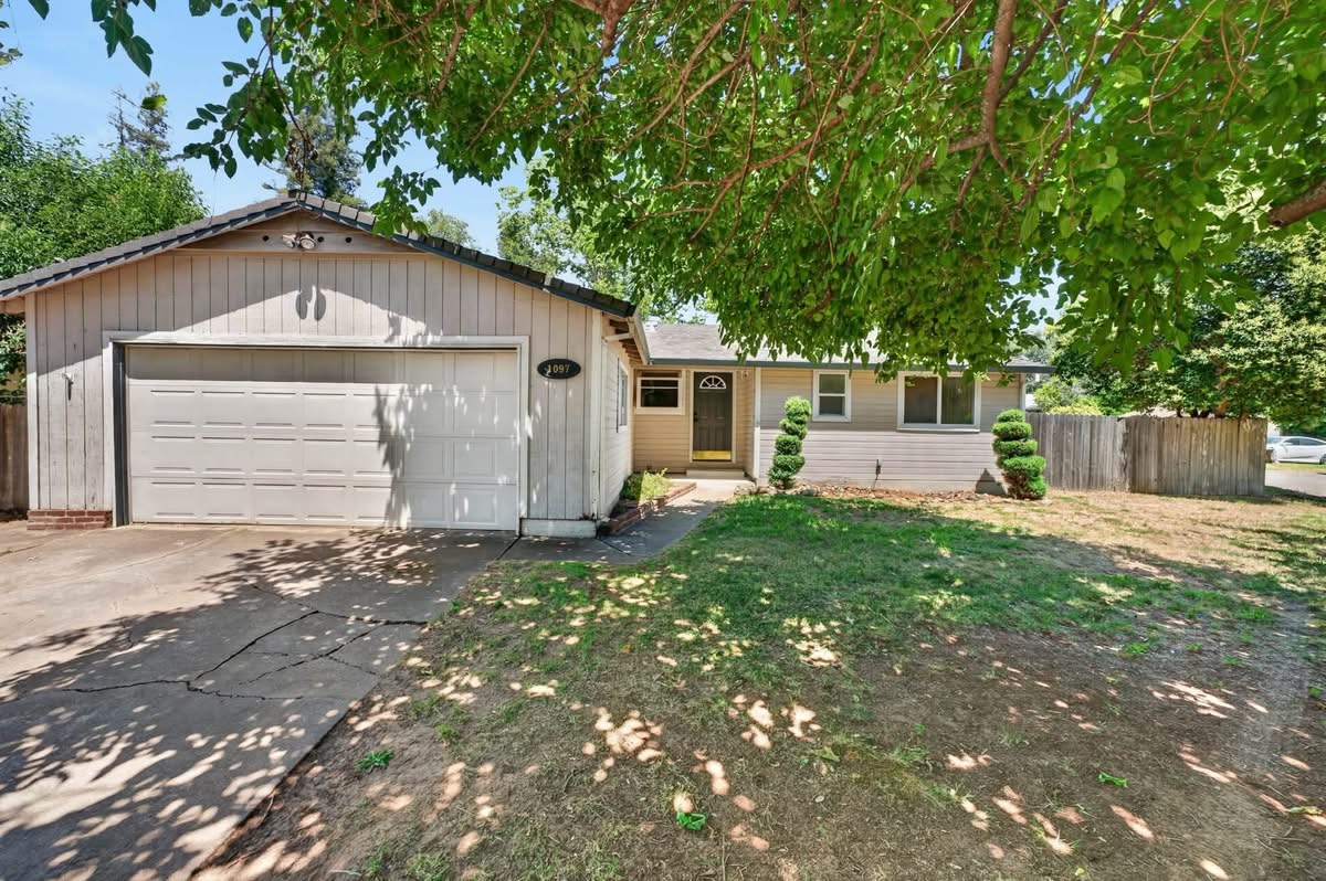 Inherited home with attached garage and front yard